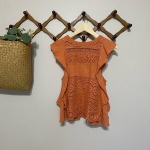 Anthropologie orange lace top with ruffled trim and eyelet detailing